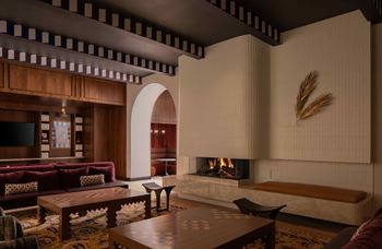A living room with a fireplace and a tv